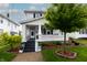 Attractive two-story house featuring a welcoming front porch and well-maintained yard at 1207 Chestnut St, Columbus, IN 47201
