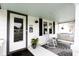 Relaxing front porch with seating, a rocking chair, and charming decor at 1207 Chestnut St, Columbus, IN 47201
