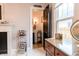 Hallway with view of restroom and hardwood floors at 1207 Chestnut St, Columbus, IN 47201