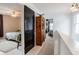 Charming hallway with an antique hutch and views of bedrooms, creating a welcoming and stylish transition at 1207 Chestnut St, Columbus, IN 47201