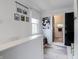 Bright hallway with decor, natural light, and doorway to bathroom; a blend of style and functionality at 1207 Chestnut St, Columbus, IN 47201