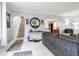 Open-concept living room showcasing stylish decor and a staircase leading to the upper level at 1207 Chestnut St, Columbus, IN 47201