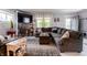 Spacious living room with a large sectional sofa, area rug, and natural light at 1207 Chestnut St, Columbus, IN 47201