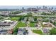 Aerial view of homes and buildings in a city neighborhood with downtown skyline at 1212 S Senate Ave, Indianapolis, IN 46225