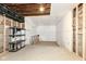 Unfinished basement area with concrete floor and exposed framing, offering potential for customization at 1212 S Senate Ave, Indianapolis, IN 46225