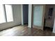 Room featuring modern flooring, a translucent sliding door, and a bathroom sink at 1212 S Senate Ave, Indianapolis, IN 46225