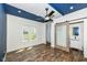 Bright room with unique ceiling, sliding door, laminate flooring, and lots of natural light at 1212 S Senate Ave, Indianapolis, IN 46225