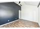 Bedroom features wood flooring, vaulted ceiling, and dark accent wall, offering stylish design at 1212 S Senate Ave, Indianapolis, IN 46225