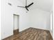 Bright bedroom features wood-look floors, a ceiling fan, and a walk-in closet at 1212 S Senate Ave, Indianapolis, IN 46225