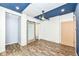 This is a bedroom with wood floors, a ceiling fan, and a sliding barn door at 1212 S Senate Ave, Indianapolis, IN 46225