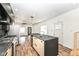 Modern kitchen with center island, stainless steel appliances, and an open floor plan at 1212 S Senate Ave, Indianapolis, IN 46225