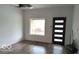 Bright living room with modern front door, big window, and contemporary flooring at 1212 S Senate Ave, Indianapolis, IN 46225