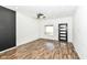 Bright living room with modern ceiling fan, laminate flooring, and lots of natural light at 1212 S Senate Ave, Indianapolis, IN 46225
