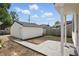 Spacious backyard featuring a detached garage, patio area, and ample space for outdoor activities and landscaping at 1231 Marlowe Ave, Indianapolis, IN 46202