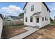 Charming backyard showcasing a newly laid patio and landscaping leading to the home's entrance at 1231 Marlowe Ave, Indianapolis, IN 46202