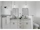 Modern bathroom features double vanity with granite countertop, two pendant lights and walk-in shower at 1231 Marlowe Ave, Indianapolis, IN 46202