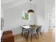 Cozy dining area featuring a wooden table, plush seating, modern lighting, and bright natural light at 1231 Marlowe Ave, Indianapolis, IN 46202