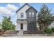 Modern two-story home with black and white exterior, landscaped yard, and covered front porch at 1231 Marlowe Ave, Indianapolis, IN 46202