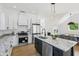 Bright, modern kitchen with stainless steel appliances, granite countertops, and a stylish island at 1231 Marlowe Ave, Indianapolis, IN 46202