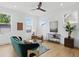 Bright living room features modern ceiling fan, light wood floors, and contemporary furnishings at 1231 Marlowe Ave, Indianapolis, IN 46202