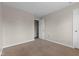 Bedroom featuring neutral walls, carpet, a window, white door, and standard baseboard trim at 12422 River Valley Dr, Fishers, IN 46037