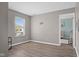 Bedroom featuring neutral walls, vinyl flooring, double-hung window, and an open doorway to another room at 12422 River Valley Dr, Fishers, IN 46037