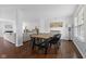 Open dining area with a large wood table and modern decor, ideal for Gathering meals and entertaining at 12422 River Valley Dr, Fishers, IN 46037