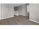 Hallway landing with neutral walls, vinyl wood flooring, white banister railing, and a few framed images on the wall at 12422 River Valley Dr, Fishers, IN 46037