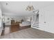 Bright and open living room with hardwood floors and stairs to the upper level at 12422 River Valley Dr, Fishers, IN 46037
