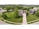 Picturesque aerial view of a home with a well-manicured lawn in a suburban neighborhood at 14130 Autumn Woods Dr, Carmel, IN 46074