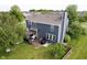Aerial view of a beautiful home featuring a well-manicured lawn and outdoor living space at 14130 Autumn Woods Dr, Carmel, IN 46074