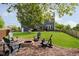 The backyard showcases a cozy fire pit and outdoor seating. Perfect spot for outdoor enjoyment at 14130 Autumn Woods Dr, Carmel, IN 46074