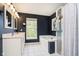 Bathroom featuring a shower, tub, vanity with double sinks, and large windows with natural light at 14130 Autumn Woods Dr, Carmel, IN 46074