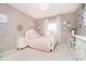 Bedroom with white furniture, plush carpet, and natural light from the window at 14130 Autumn Woods Dr, Carmel, IN 46074