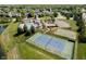 Aerial view of a community featuring a pool, tennis court, playground, and green spaces at 14130 Autumn Woods Dr, Carmel, IN 46074