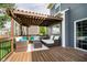 Relaxing deck space complete with a pergola, comfortable seating, and inviting decor at 14130 Autumn Woods Dr, Carmel, IN 46074