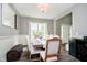 Traditional dining room with a wood table, upholstered chairs, and a view of the front door at 14130 Autumn Woods Dr, Carmel, IN 46074