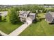 Beautiful two-story home with brick accents, attached garage, and well-manicured lawn at 14130 Autumn Woods Dr, Carmel, IN 46074