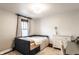 Bright bedroom with light walls, natural light, desk and neutral furnishings at 1426 N Euclid Ave, Indianapolis, IN 46201