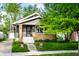 Charming home exterior with a well-manicured lawn and welcoming front porch at 1426 N Euclid Ave, Indianapolis, IN 46201