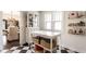 Bright kitchen with black and white checkered floors, white cabinets and ample storage space at 1426 N Euclid Ave, Indianapolis, IN 46201