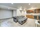 Large finished basement with stylish seating, a wet bar, and bonus area at 1540 N College Ave, Indianapolis, IN 46202