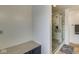 Contemporary bathroom featuring updated shower with marble accents and tile flooring at 1540 N College Ave, Indianapolis, IN 46202