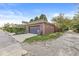 Two car brick garage with dark doors and trim at 1540 N College Ave, Indianapolis, IN 46202