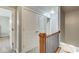 Hallway with closet and railing, providing access to different areas of the home at 1540 N College Ave, Indianapolis, IN 46202