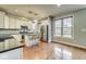 Modern kitchen with stainless steel appliances, granite countertops, and hardwood floors at 1540 N College Ave, Indianapolis, IN 46202