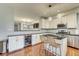 Modern kitchen with granite countertops, stainless steel appliances and an island with barstool seating at 1540 N College Ave, Indianapolis, IN 46202