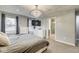Bright main bedroom with mounted TV and access to a modern shower at 1540 N College Ave, Indianapolis, IN 46202
