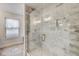 Upgraded glass shower with marble tile, shower niche and hexagon tile flooring at 1540 N College Ave, Indianapolis, IN 46202