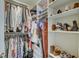 Organized walk-in closet with shelving and hanging space for clothes, shoes, and accessories at 1540 N College Ave, Indianapolis, IN 46202
